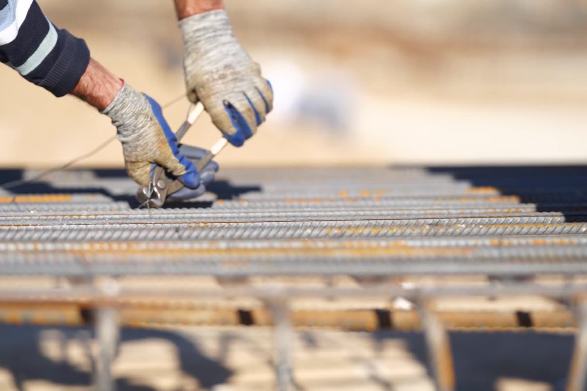 Steel reinforcement mesh being tied before the pour